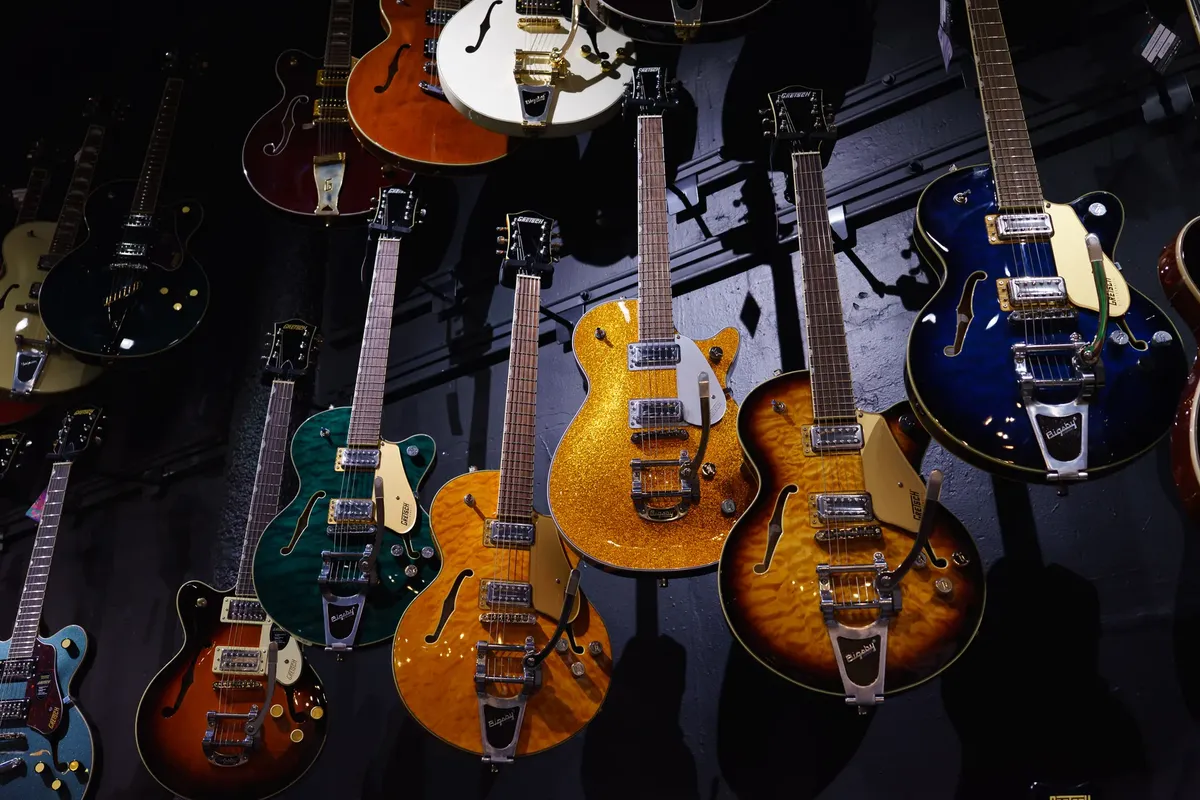 A vibrant display of colorful electric guitars at a music store in Mexico City.