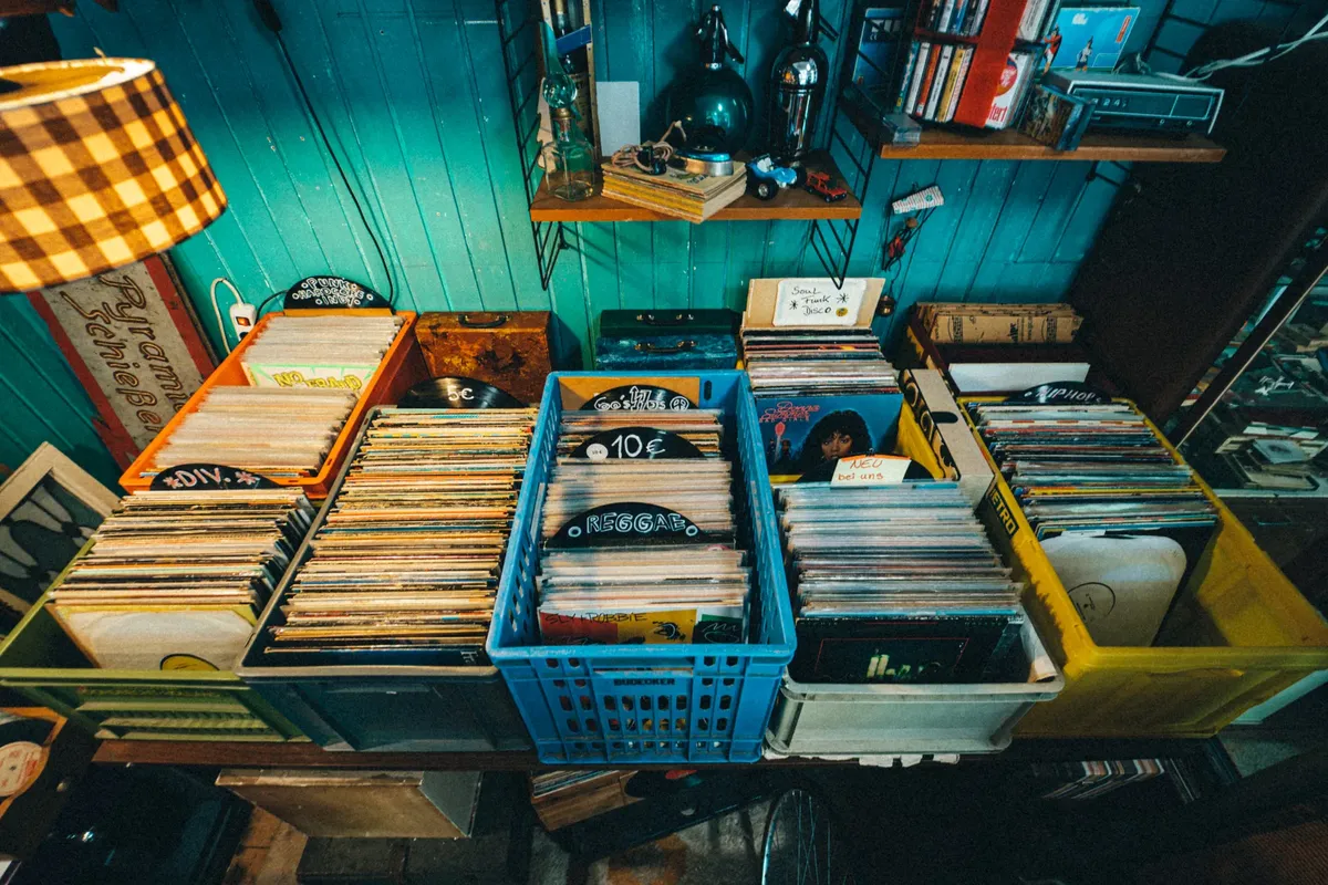 Explore a vibrant collection of vintage vinyl records in a retro store setting. Perfect for music enthusiasts.